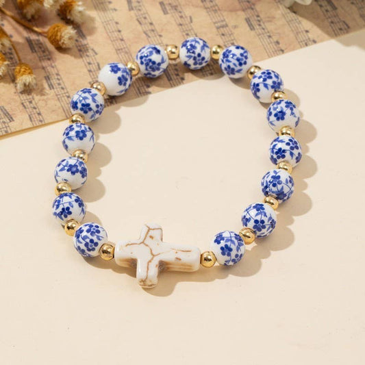 Blue Ceramic Bead Bracelet With Cross Charm And Pearl Pop